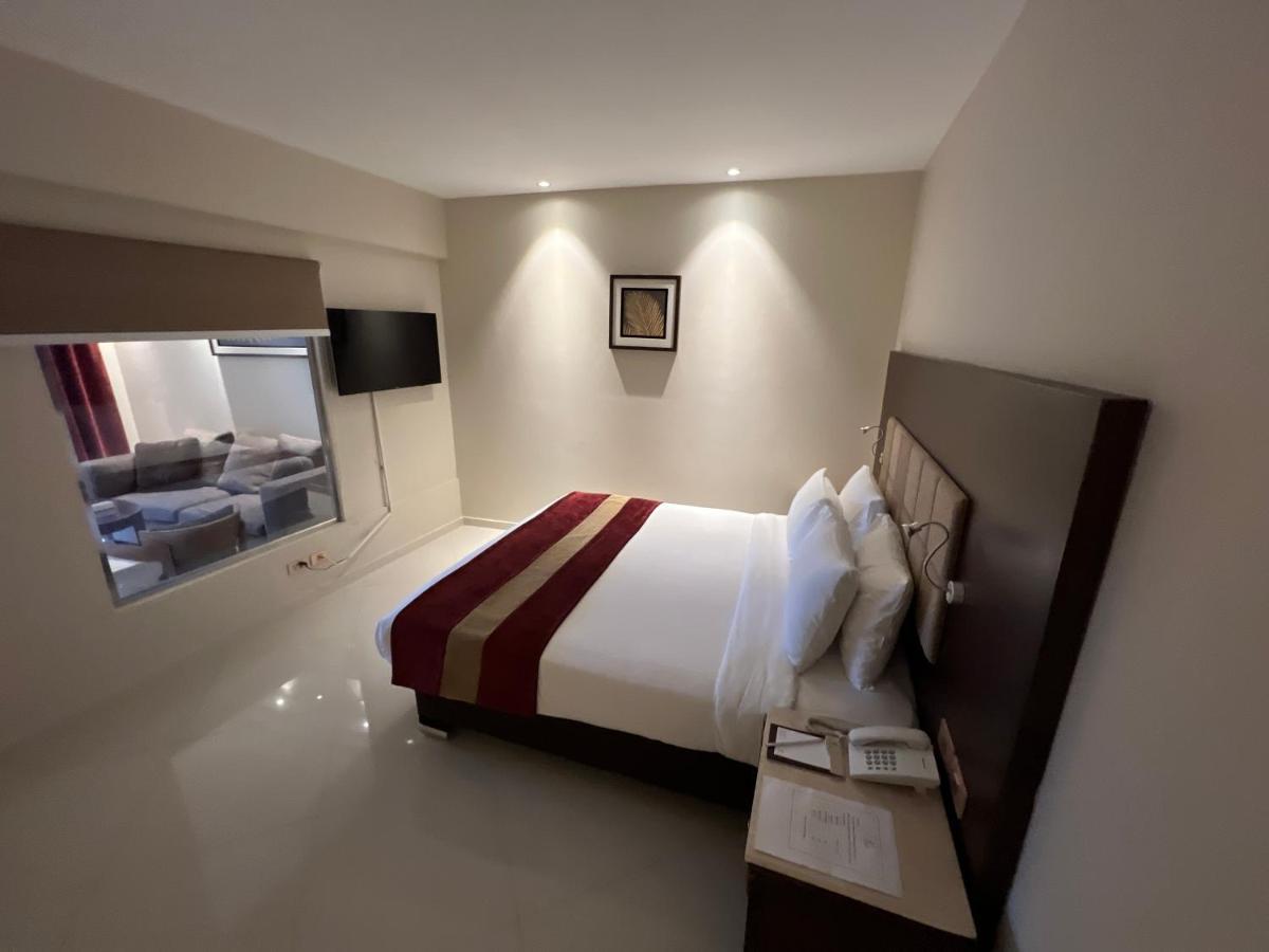 Grand Ocean El Sokhna Hotel Ain Sukhna Bagian luar foto A bedroom at the hotel